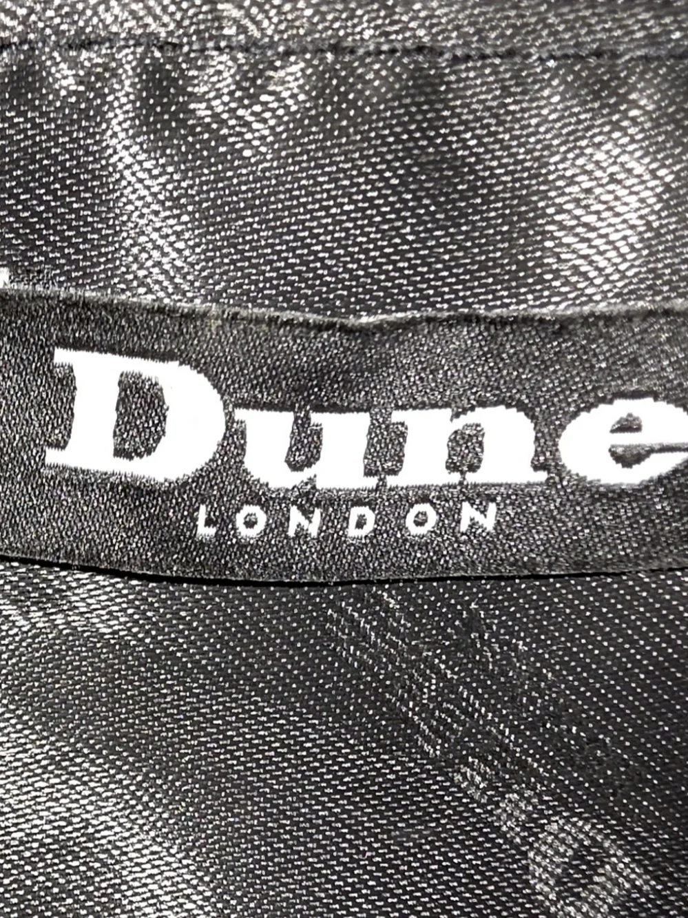 Dune London two-tone flapover crossbody bag and matching wallet set.